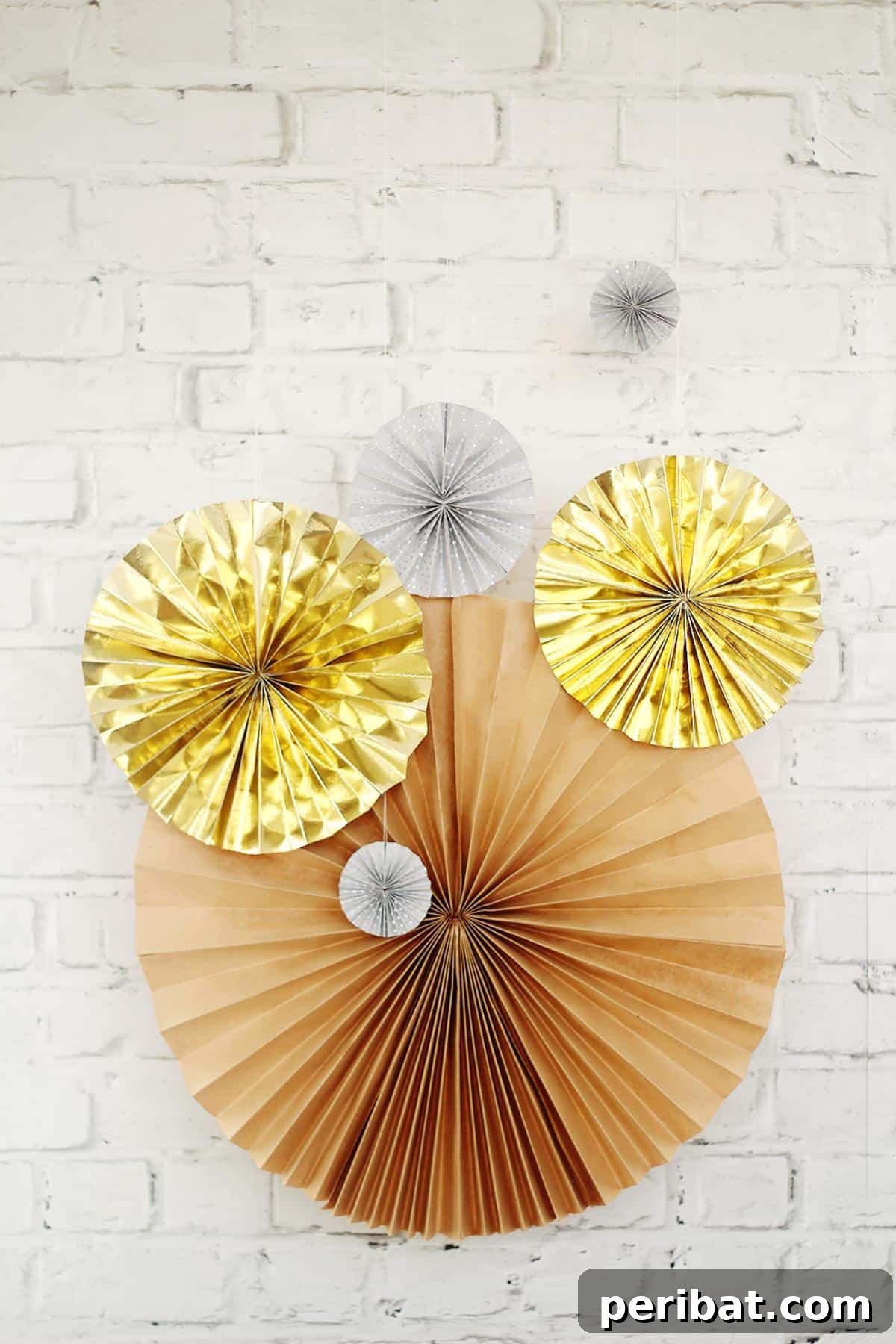 24 Creative DIY Paper Fan Projects 13 DIY New Year's Eve paper fans, easily customizable with paint or drawings to match any party theme for festive wall or ceiling decor.