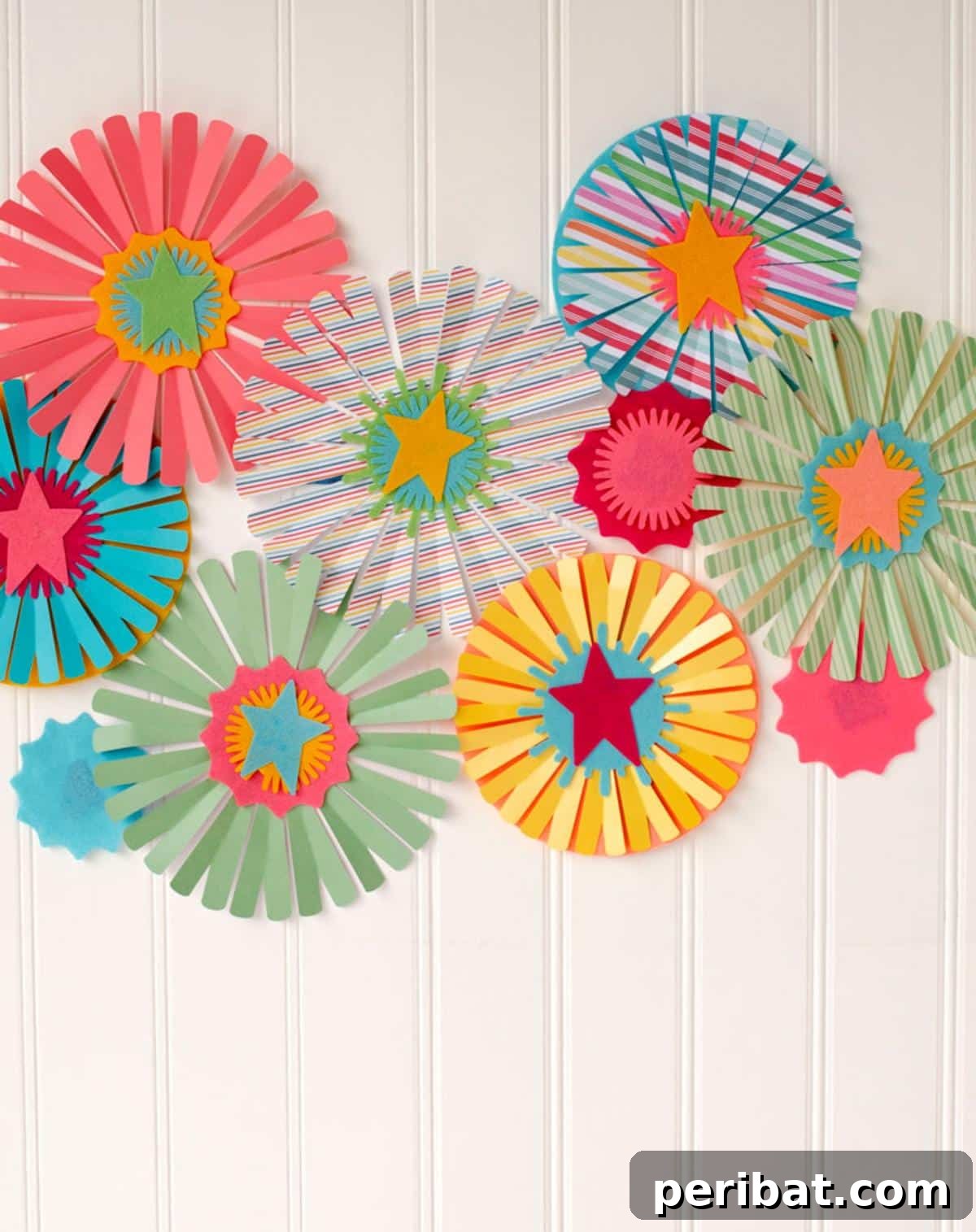 24 Creative DIY Paper Fan Projects 22 DIY party paper fans created with a Cricut Maker, scoring wheel, and felt, suitable for various celebrations like birthdays and baby showers.