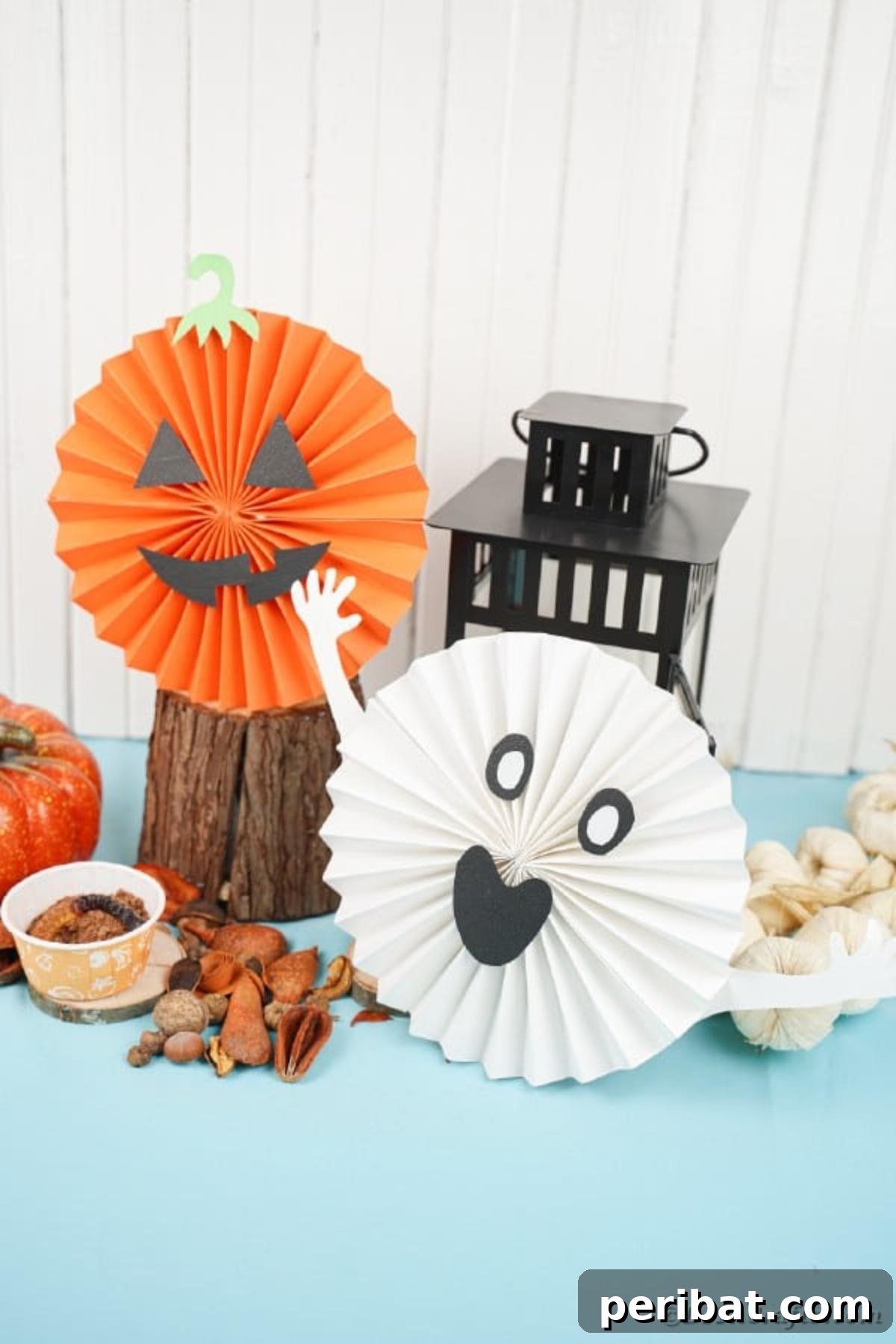 24 Creative DIY Paper Fan Projects 12 Easy handmade Halloween paper fan decorations, featuring playful ghost and pumpkin designs for a budget-friendly festive atmosphere.