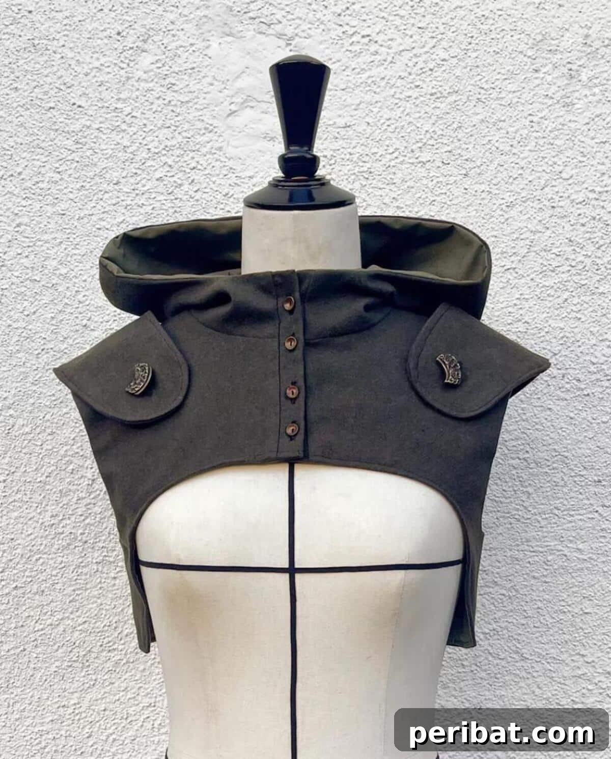 Enchanting Stitches: 20 Magical Sewing Designs 20 Hooded Half Vest, a layered and edgy garment.
