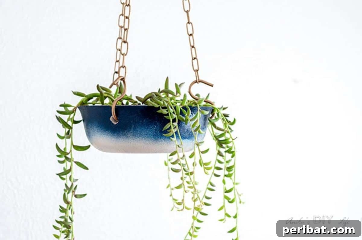 23 Modern Concrete Planter & Vase Projects 12 DIY Concrete Hanging Planter, featuring an industrial-chic design perfect for modern green spaces.