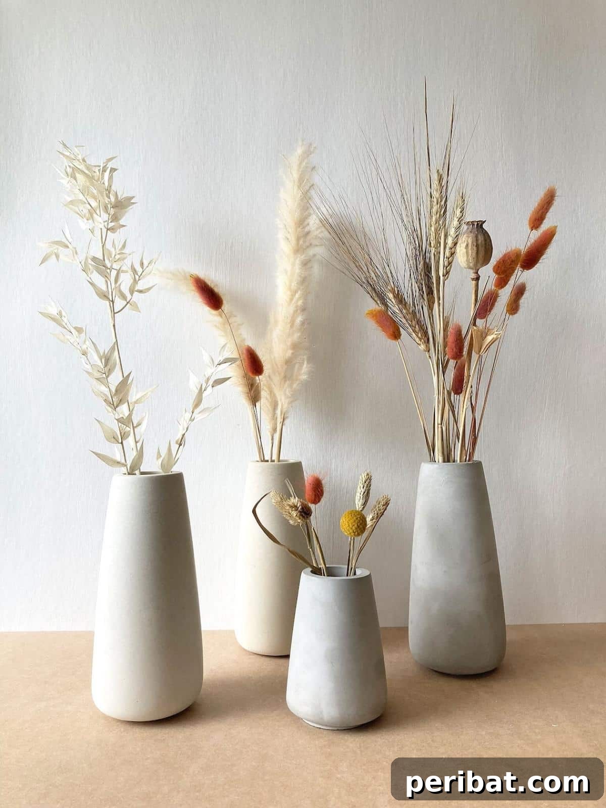 23 Modern Concrete Planter & Vase Projects 16 Minimalist Handmade Concrete Vases, showcasing modern and stylish designs for interior inspiration.