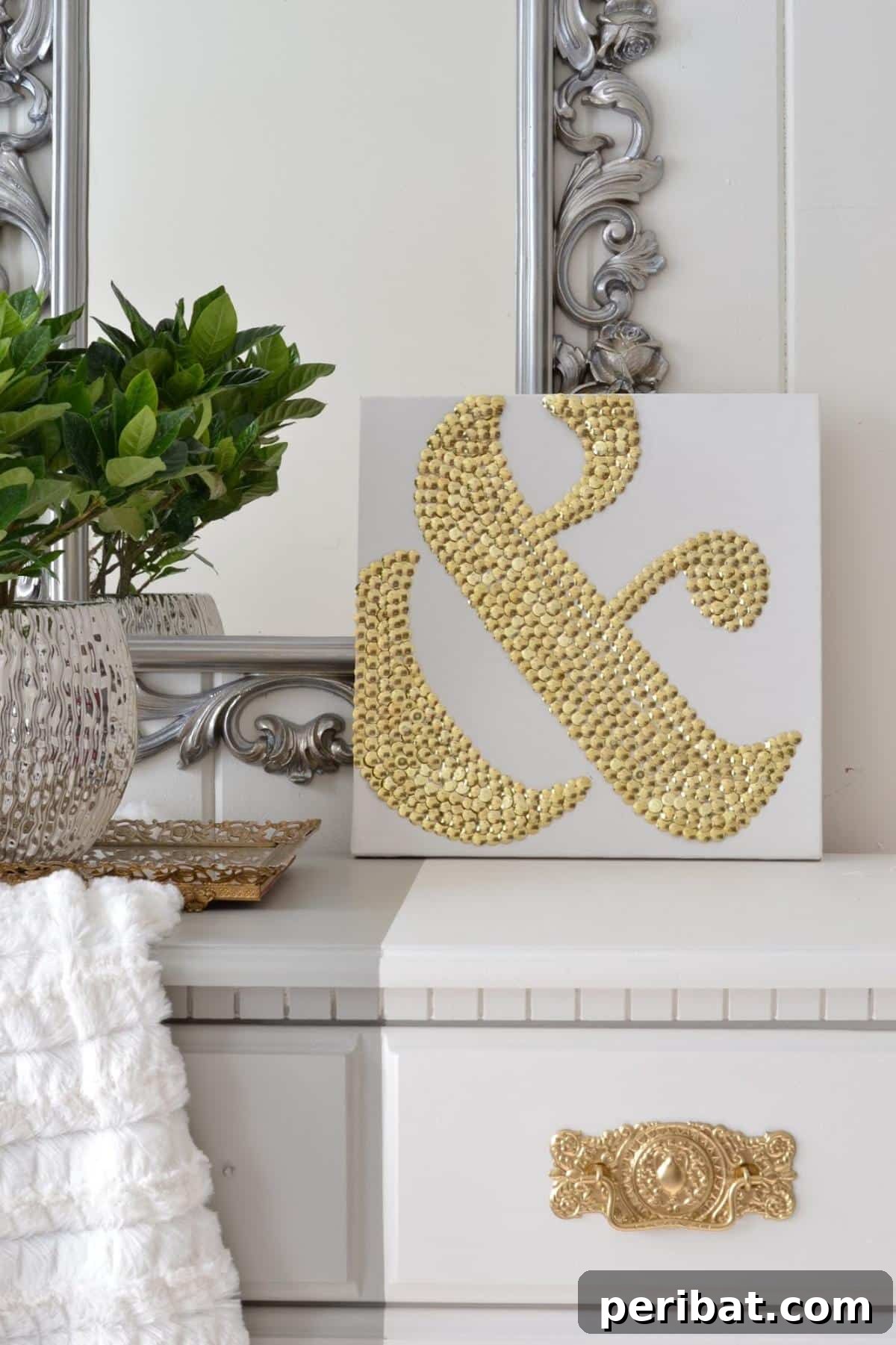 43 Easy DIY Canvas Art Projects for Stunning Home Decor 18 DIY Ampersand Art Using Thumbtacks, creating a glittering '&' symbol on a contrasting canvas.