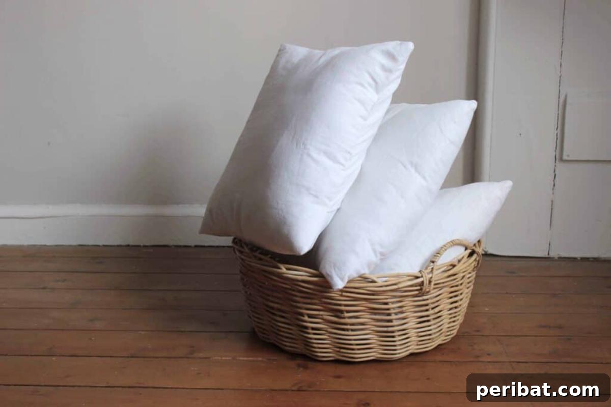 47 Inspiring DIY Throw Pillow Designs 42 A trio of simple DIY pillow covers made without zippers, showcasing a clean, easy-to-change design.