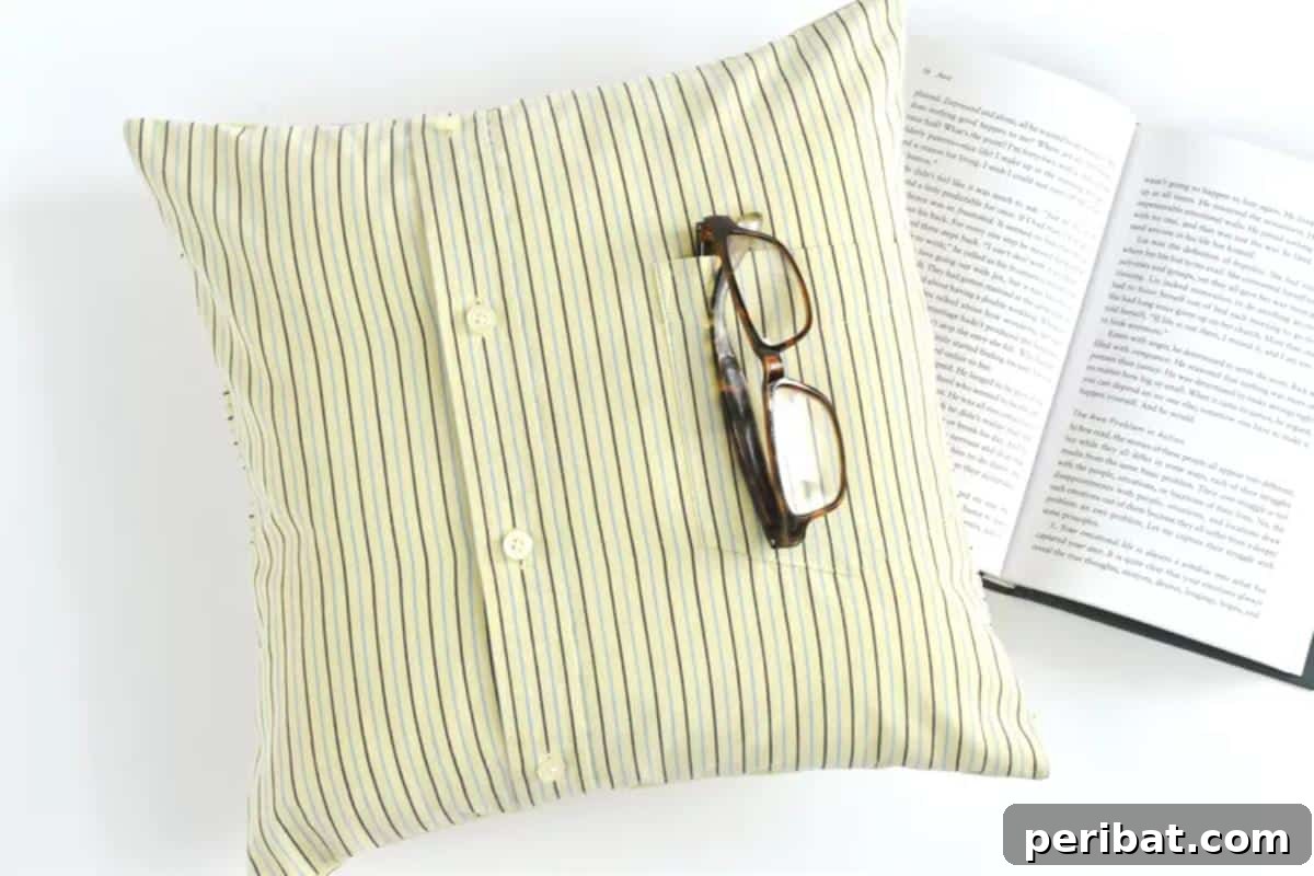 47 Inspiring DIY Throw Pillow Designs 7 A creative DIY throw pillow made from an old shirt, featuring its original buttons as a closure.