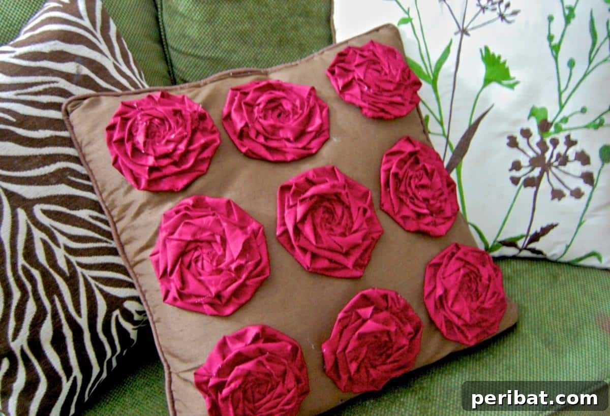 47 Inspiring DIY Throw Pillow Designs 9 A luxurious rosette throw pillow created using a glue gun, showcasing intricate fabric folds.