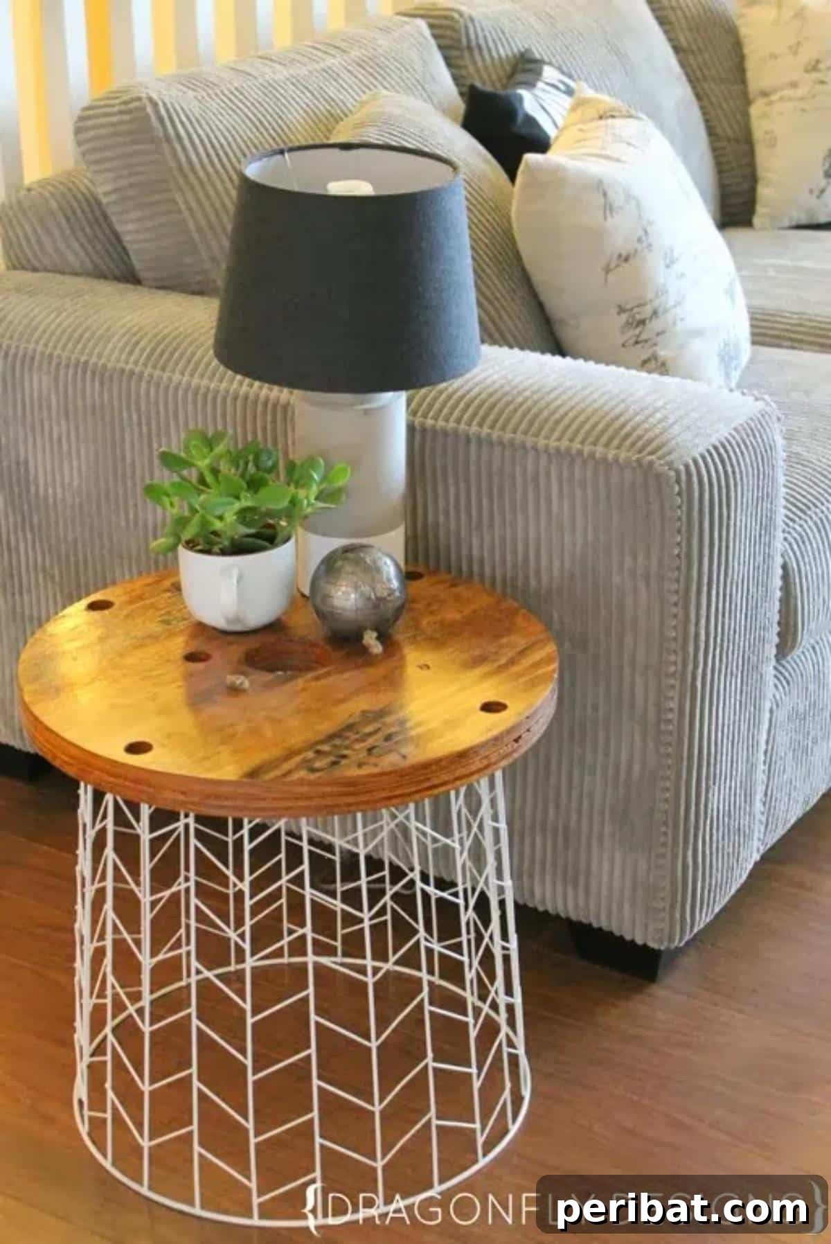 37 Simple and Stylish DIY End Tables 20 Elegant DIY accent table featuring a unique design, painted in a light color, suitable for a refined living space.