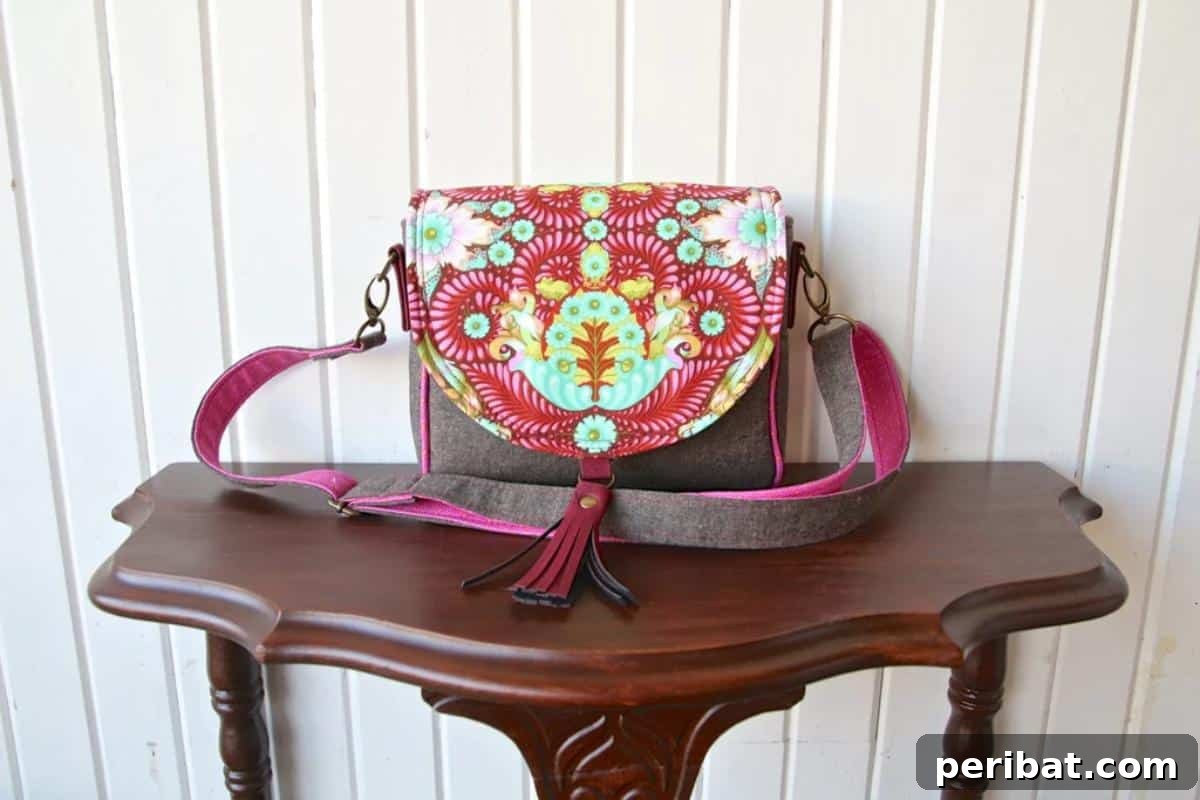A charming Sweet Pea Saddle Bag, featuring a vintage-inspired design and a practical crossbody style.