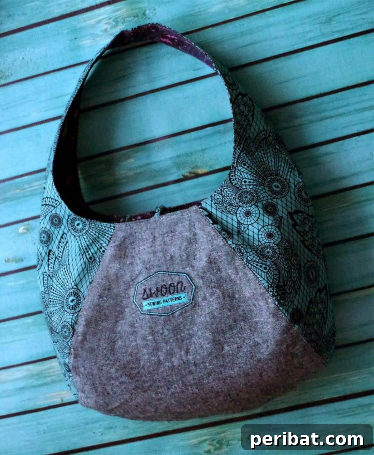 A versatile Laney Reversible Hobo Bag, offering two distinct looks in one stylish design for adaptable fashion.