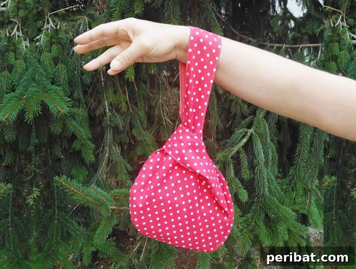 A unique and elegant Japanese Knot Bag, characterized by its asymmetrical handle design and practical size for daily use.