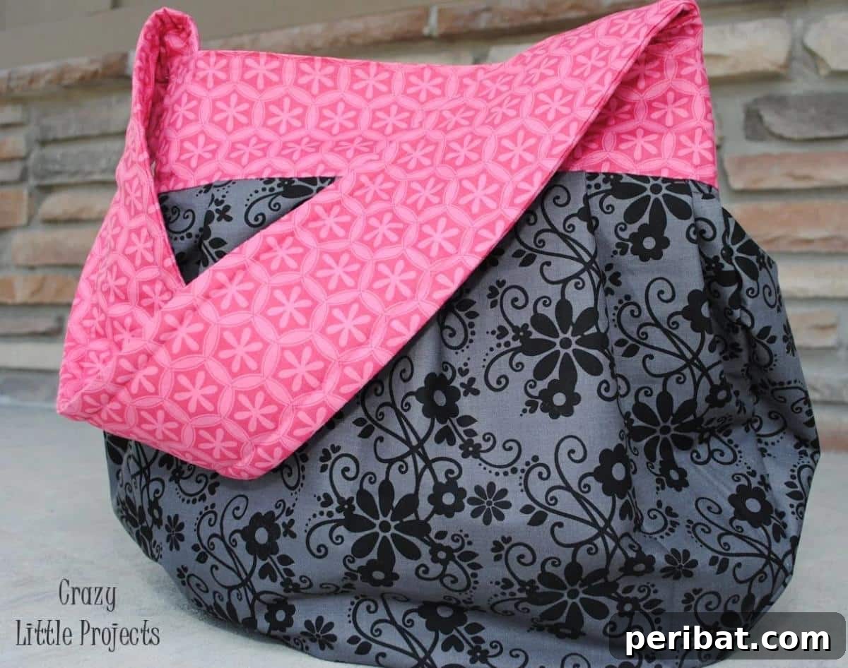 A comfortable and convenient Sling Tote, perfect for individuals who are always on the go and need an easy-to-carry bag.