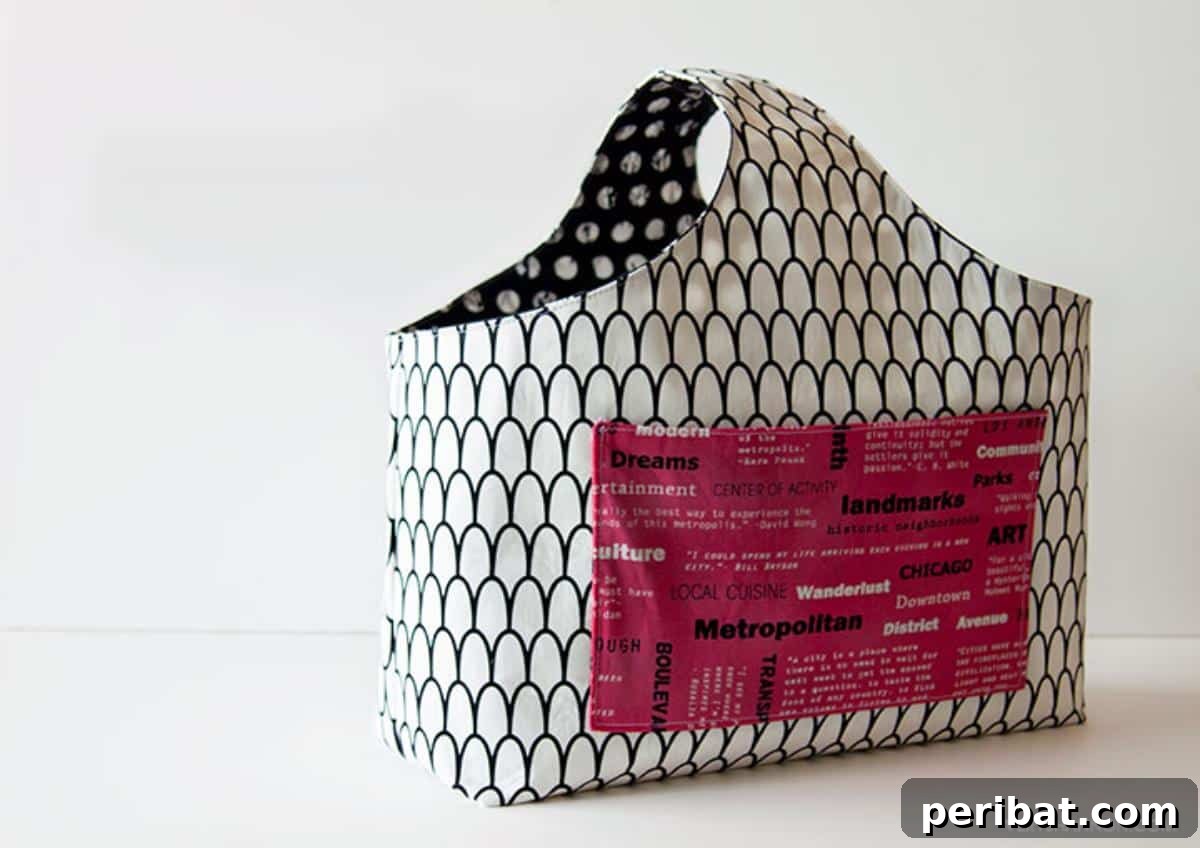 A clever reversible box tote bag, showcasing two distinct fabric designs for versatile styling options.