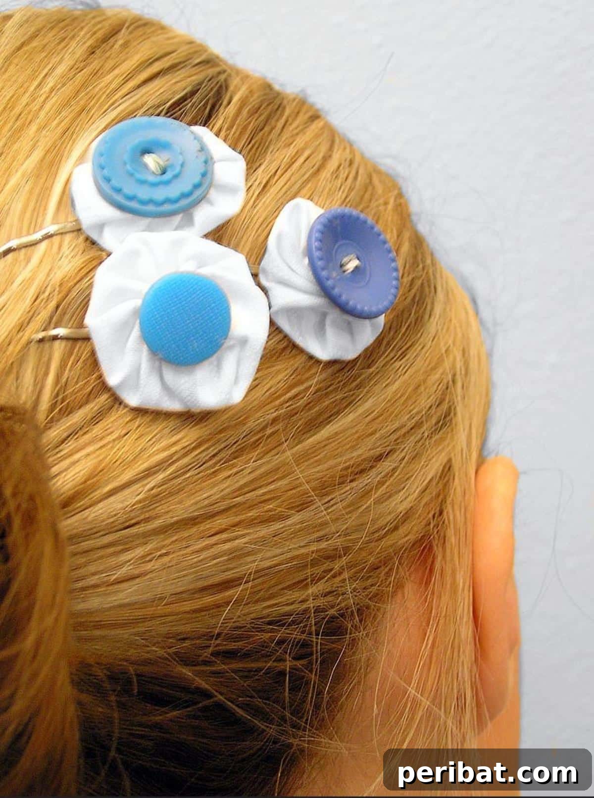Craft Your Dream Wedding: 20 DIY Accessory Ideas 16 A set of delicate DIY 'something blue' hairpins, featuring small blue fabric flowers or buttons, perfect for a bride or as gifts for bridesmaids.