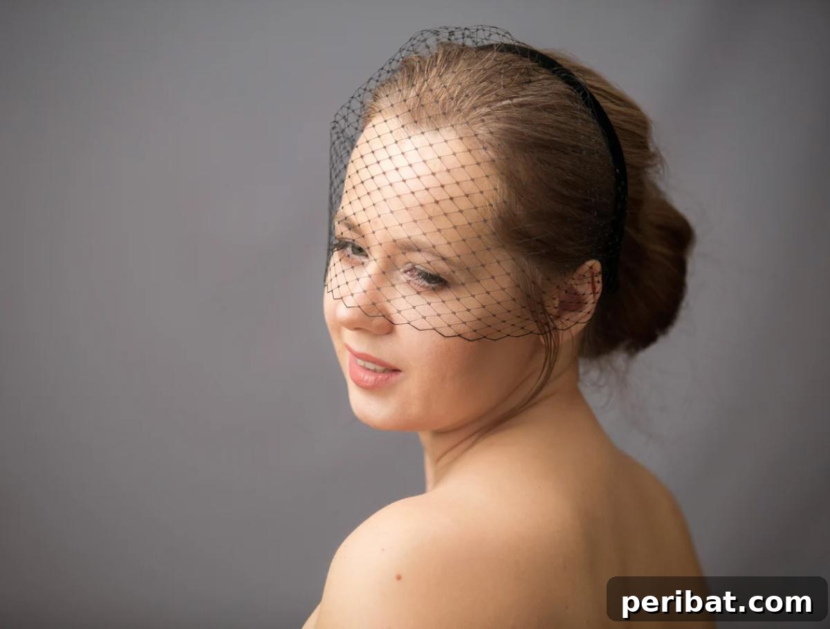 Craft Your Dream Wedding: 20 DIY Accessory Ideas 19 A stylish DIY birdcage veil headband, made with delicate netting and adorned with a floral embellishment, perfect for a vintage-inspired bridal look.
