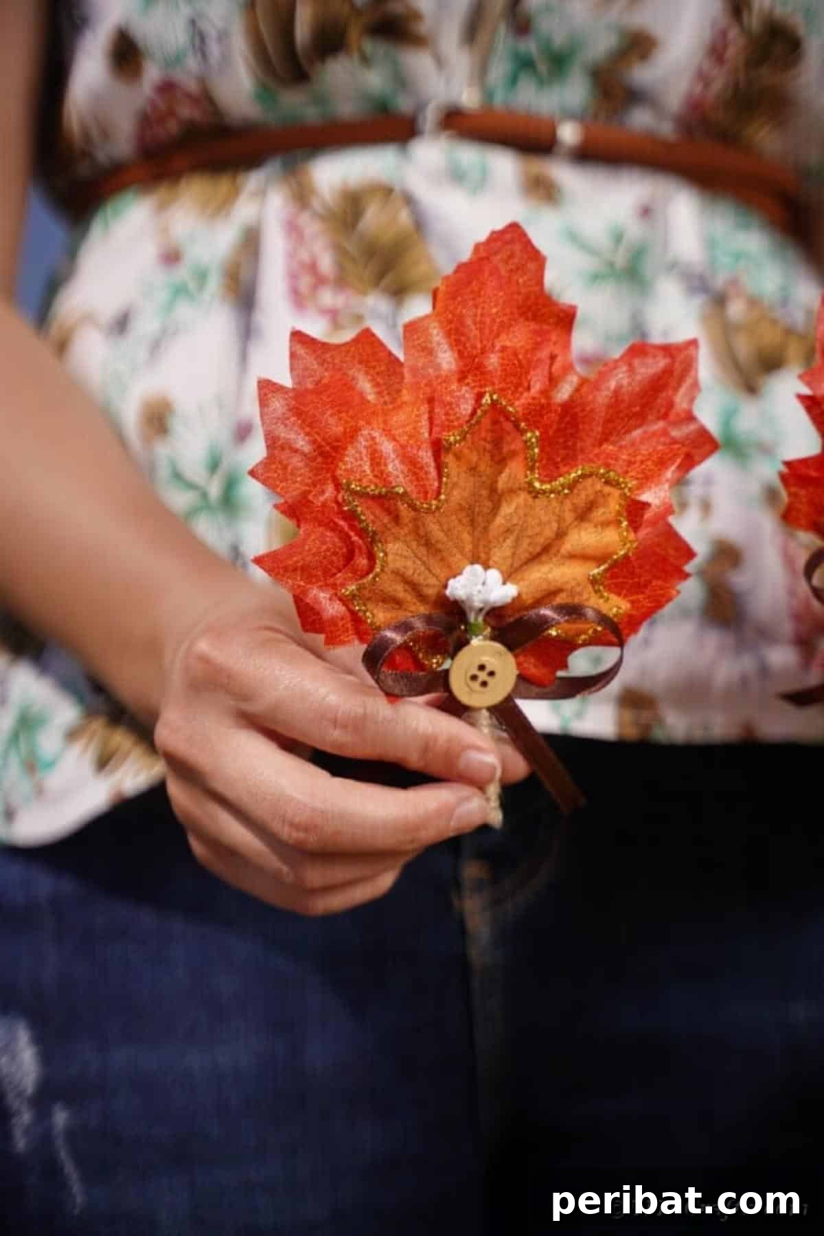 Craft Your Dream Wedding: 20 DIY Accessory Ideas 3 A beautifully crafted DIY fall leaf boutonniere, featuring artificial leaves and glitter, perfect for a wedding, prom, or special event.