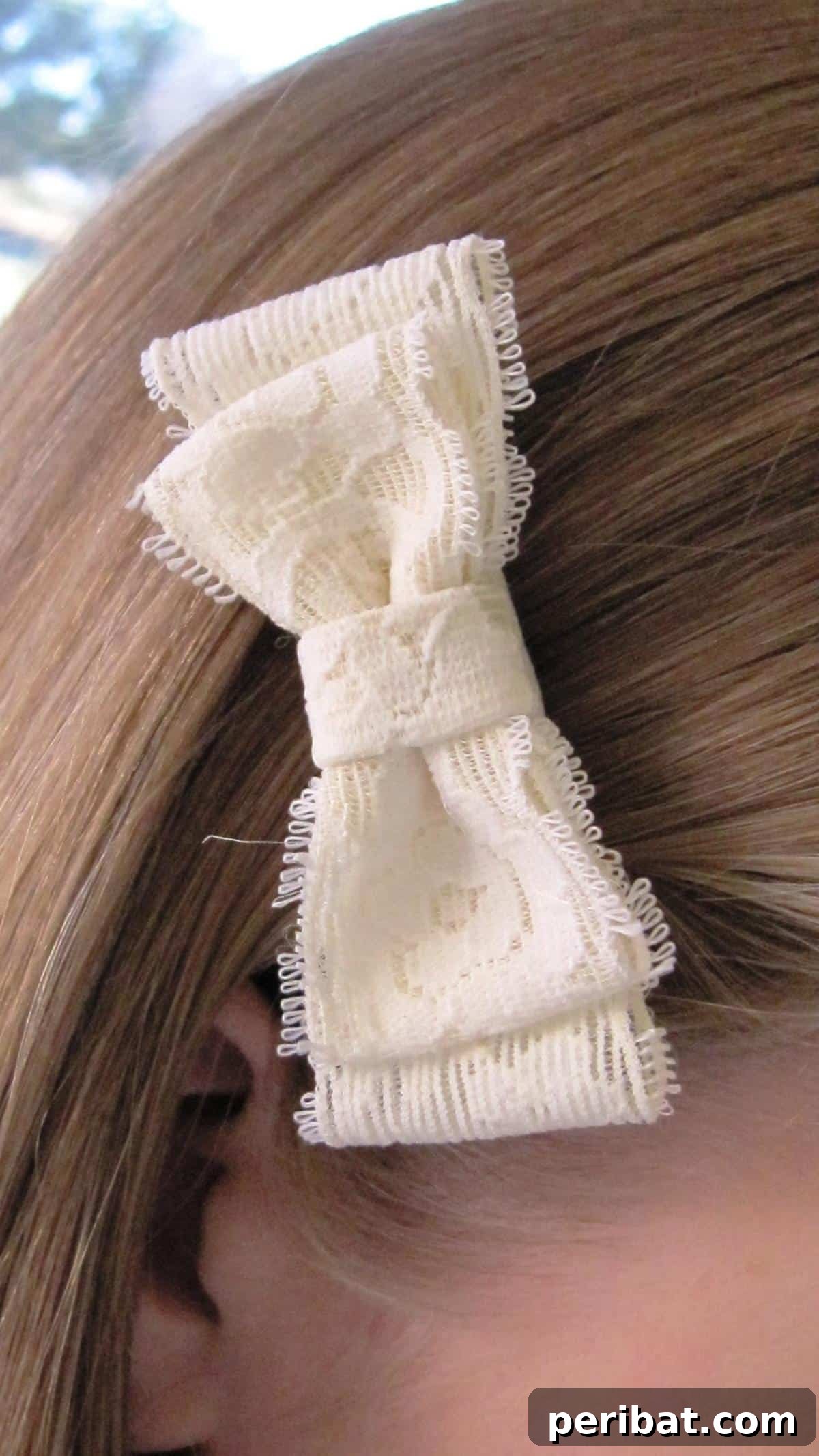 Craft Your Dream Wedding: 20 DIY Accessory Ideas 9 A stylish DIY lace bow accessory, reminiscent of an Anthropologie design, crafted from delicate lace and ready to be clipped into hair.