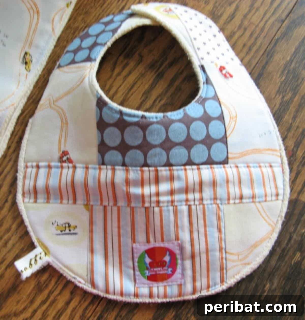 Unlock Your Creativity: 38 Beginner Sewing Projects 22 A colorful Quilted Patchwork Bib, perfect for toddlers and babies.