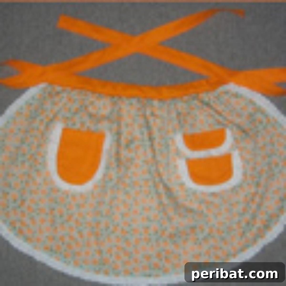 Groovy Garments: 38 70s Sewing Patterns for Timeless Style 36 Retro Orange-Flowered Apron