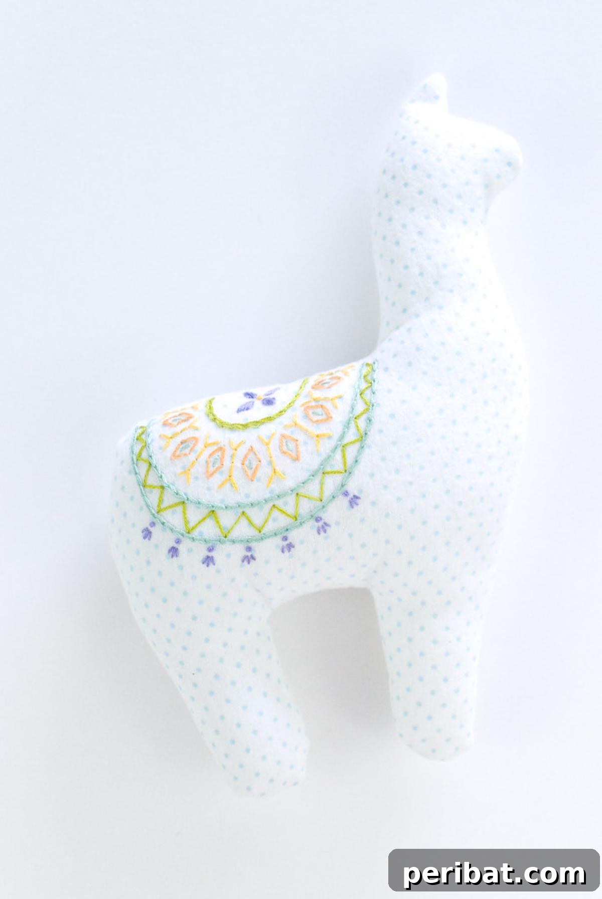 DIY Embroidered Plush Alpaca Softie, a uniquely decorated creation.
