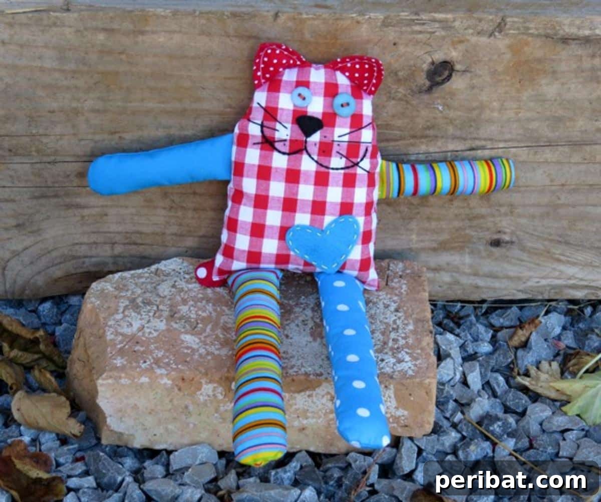 DIY Carefree Cat From Scraps, a relaxed and content plushie.