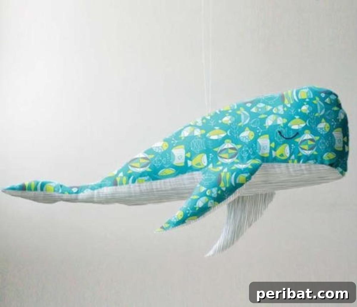Wallace the Whale Plush, a friendly marine creature.