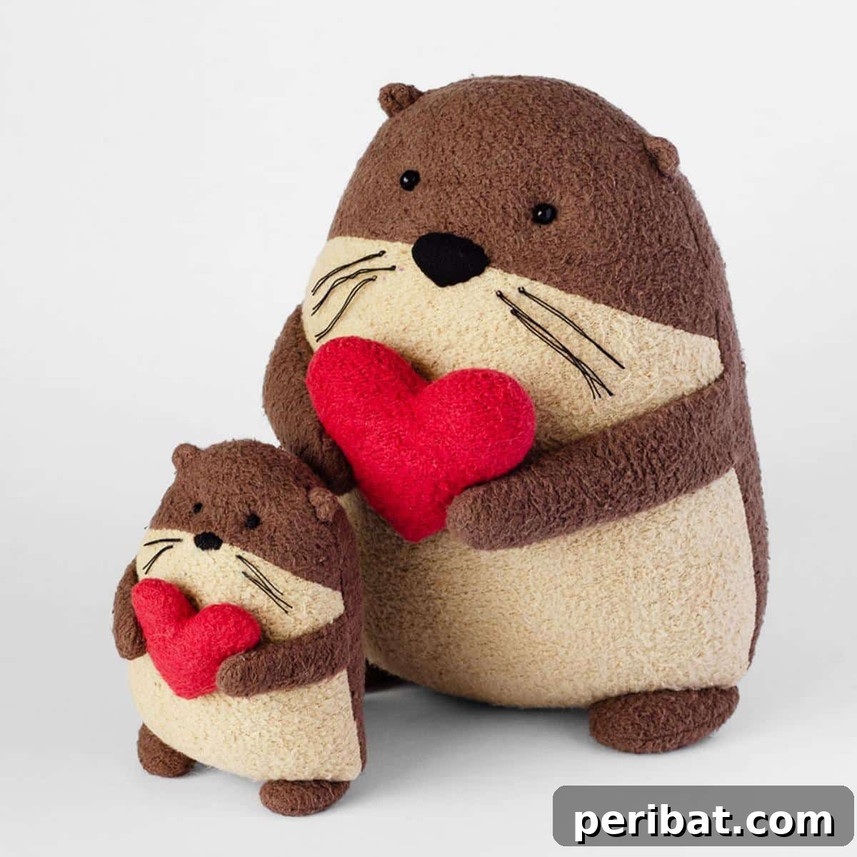Squeakers the Otter plush toys, made from brown and tan fleece.