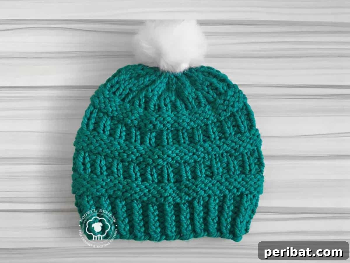 29 Inspiring Circular Knitting Designs 16 A close-up of the Cole Hat Circular Knitting Pattern, highlighting its super bulky yarn and textured fabric, designed for ultimate warmth and a stylish, form-fitting look.