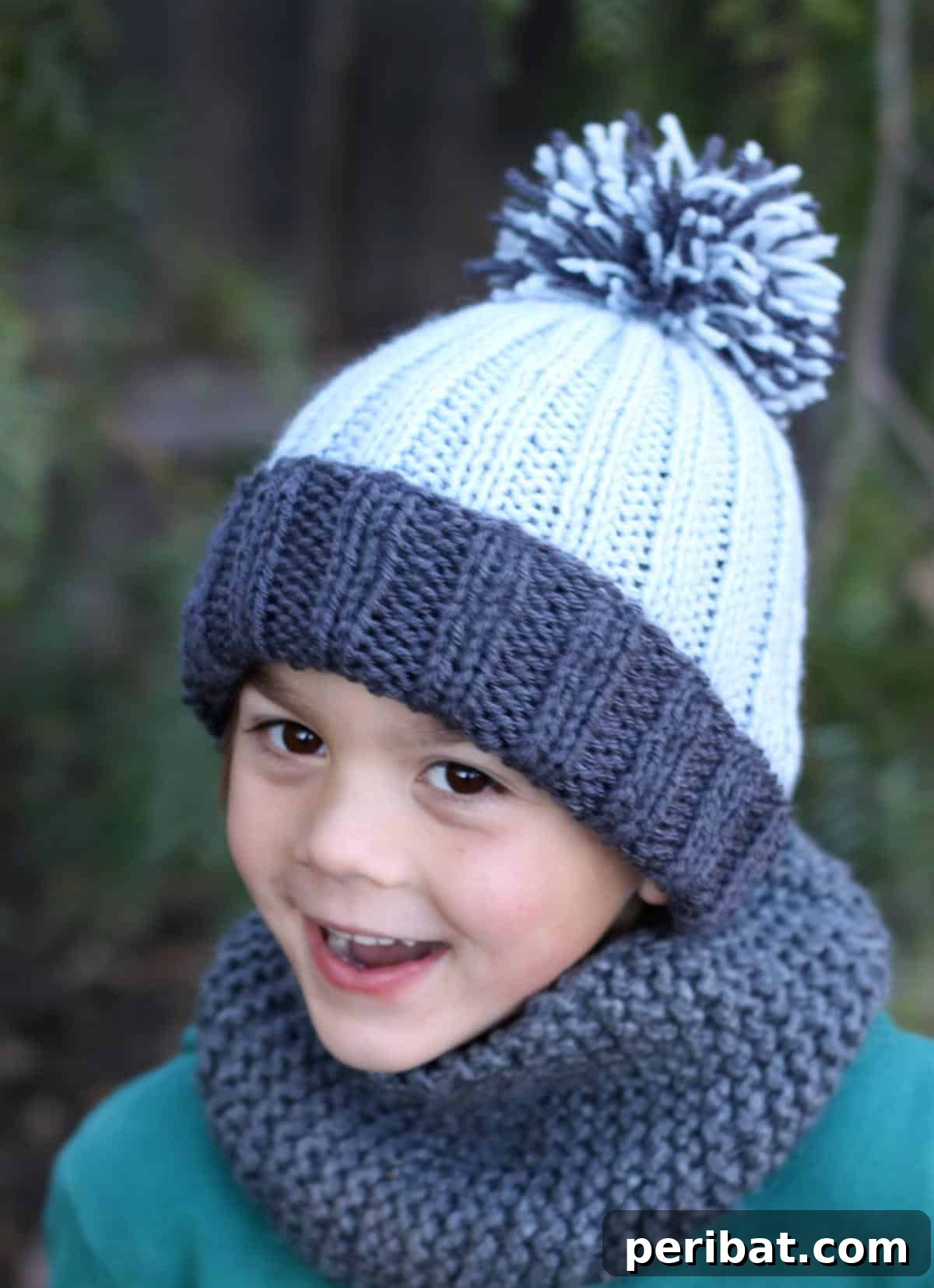 29 Inspiring Circular Knitting Designs 18 A clean image of a Simple Ribbed Knit Hat in a soft, neutral yarn, highlighting its versatile design and the option to add a playful pom-pom.