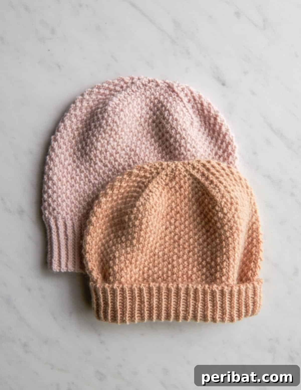 29 Inspiring Circular Knitting Designs 19 A collection of fluffy brioche stitch hats in various soft pastel colors, emphasizing their luxurious softness and delightful textured dimension, made with cashmere merino wool.