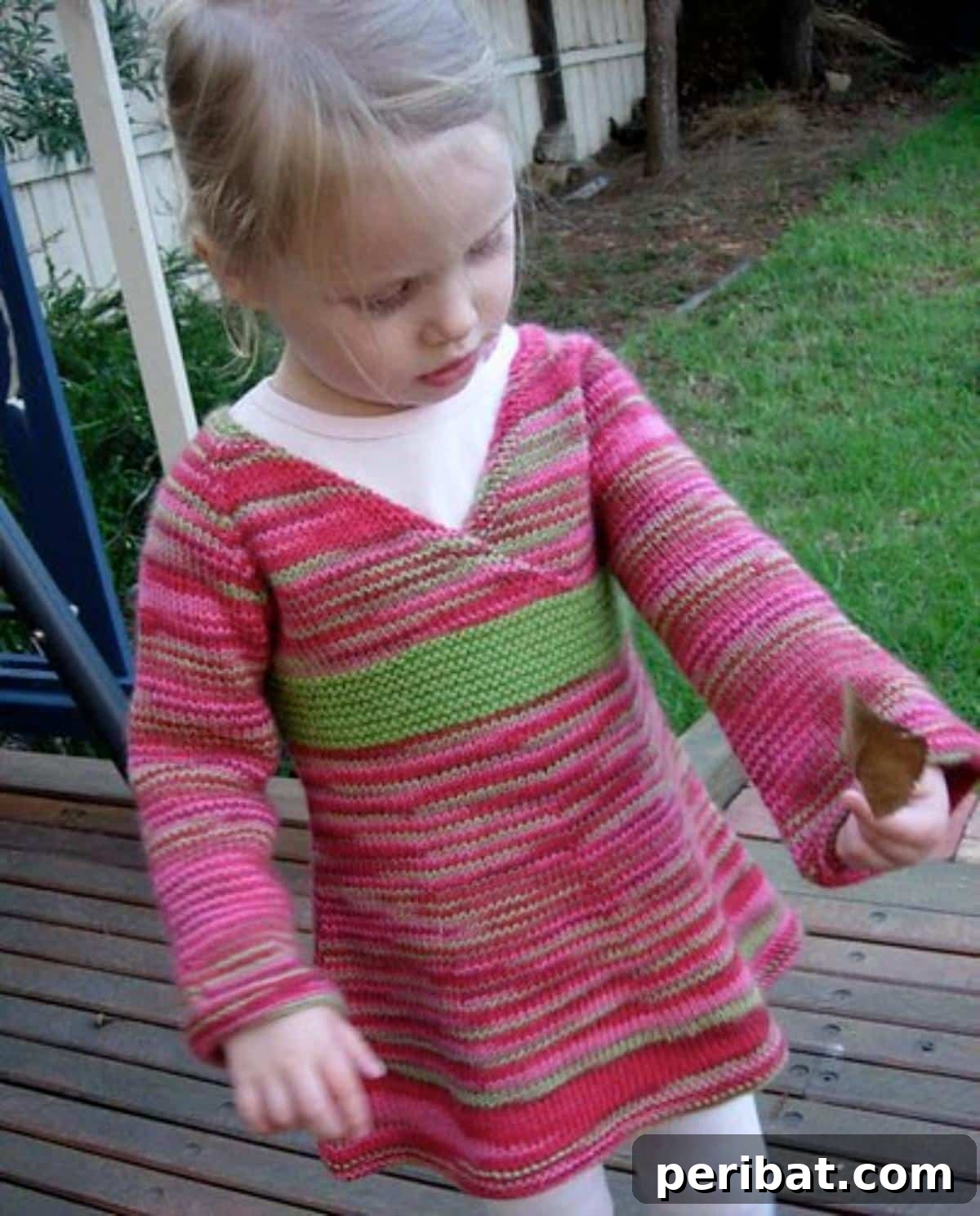 29 Inspiring Circular Knitting Designs 23 A beautifully crafted Oriental Lily Sweater, showcasing a charming mock obi sash, a crossover bodice, and elegant flared sleeves, inspired by kimono and ballet styles.