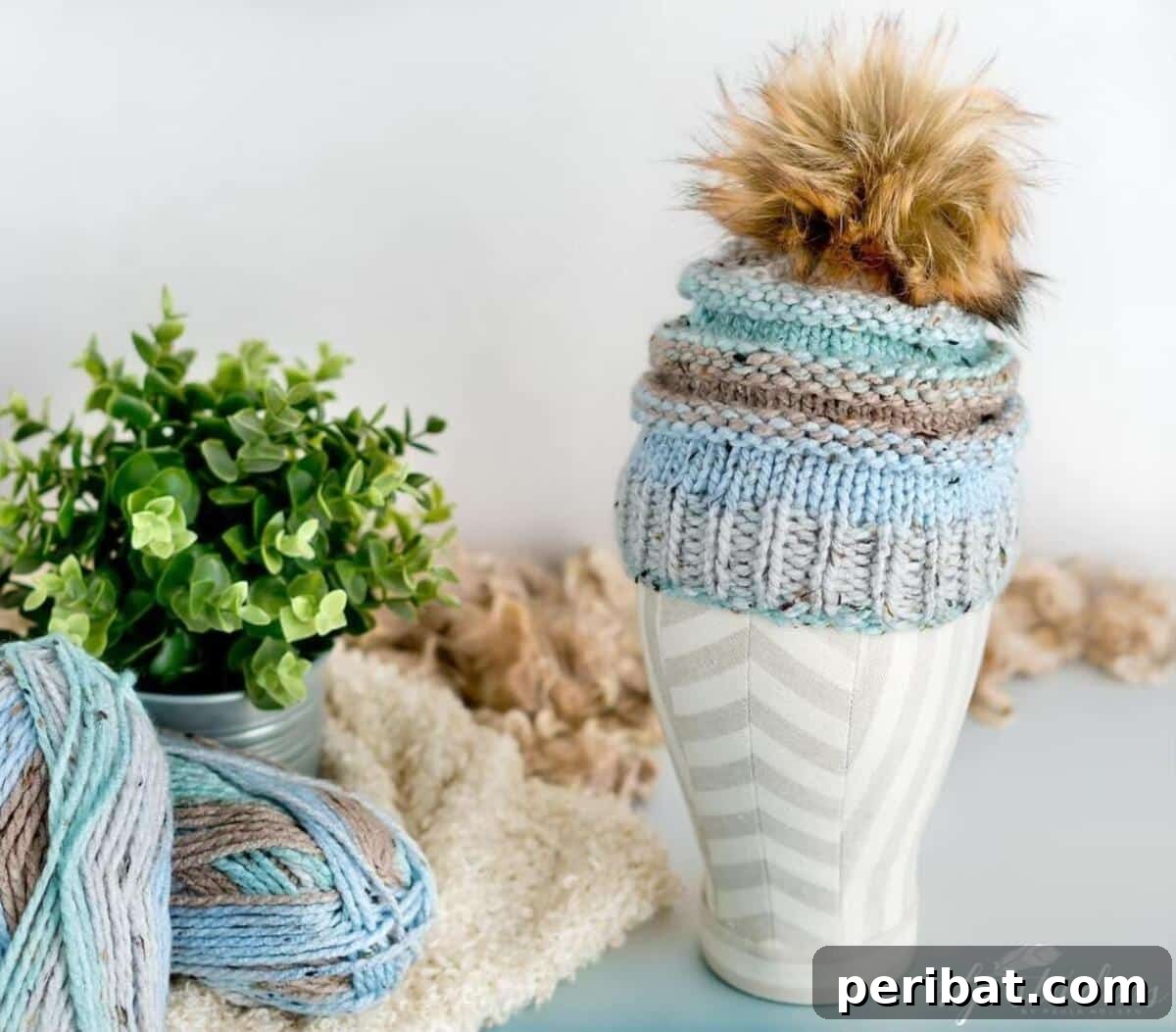 29 Inspiring Circular Knitting Designs 27 The Brooklyn Beanie, a vibrant and colorful circular knitting pattern, topped with an extra puffy pom-pom, perfect for adding fun and adventure to city style.