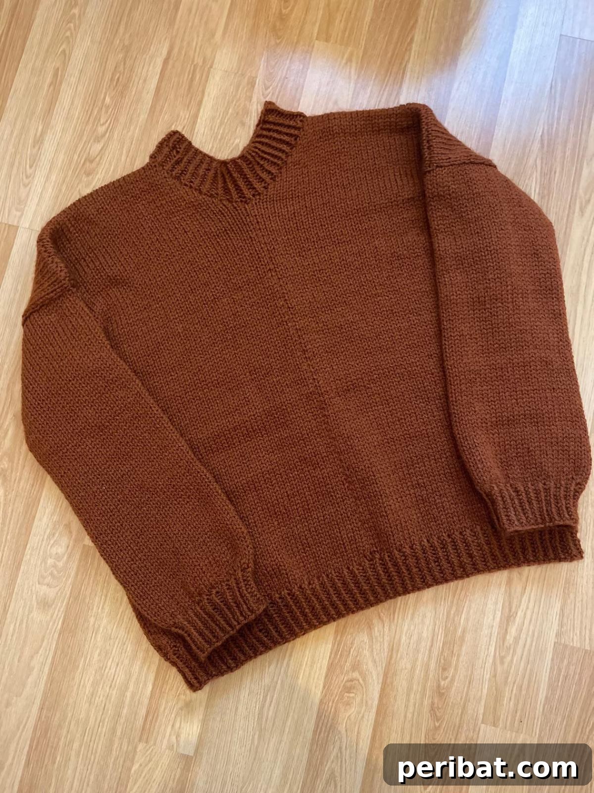 29 Inspiring Circular Knitting Designs 30 A model wearing a Basic Collar Neck Shaping Women’s Jumper, highlighting its plain and simple design which makes it perfect for everyday wear and versatile styling.