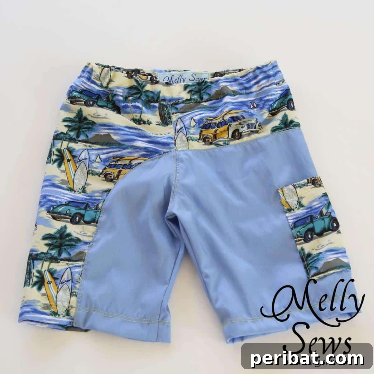 Stylish and functional swim trunks featuring a unique dual design with a surf-themed print and a solid color, complete with practical pockets.
