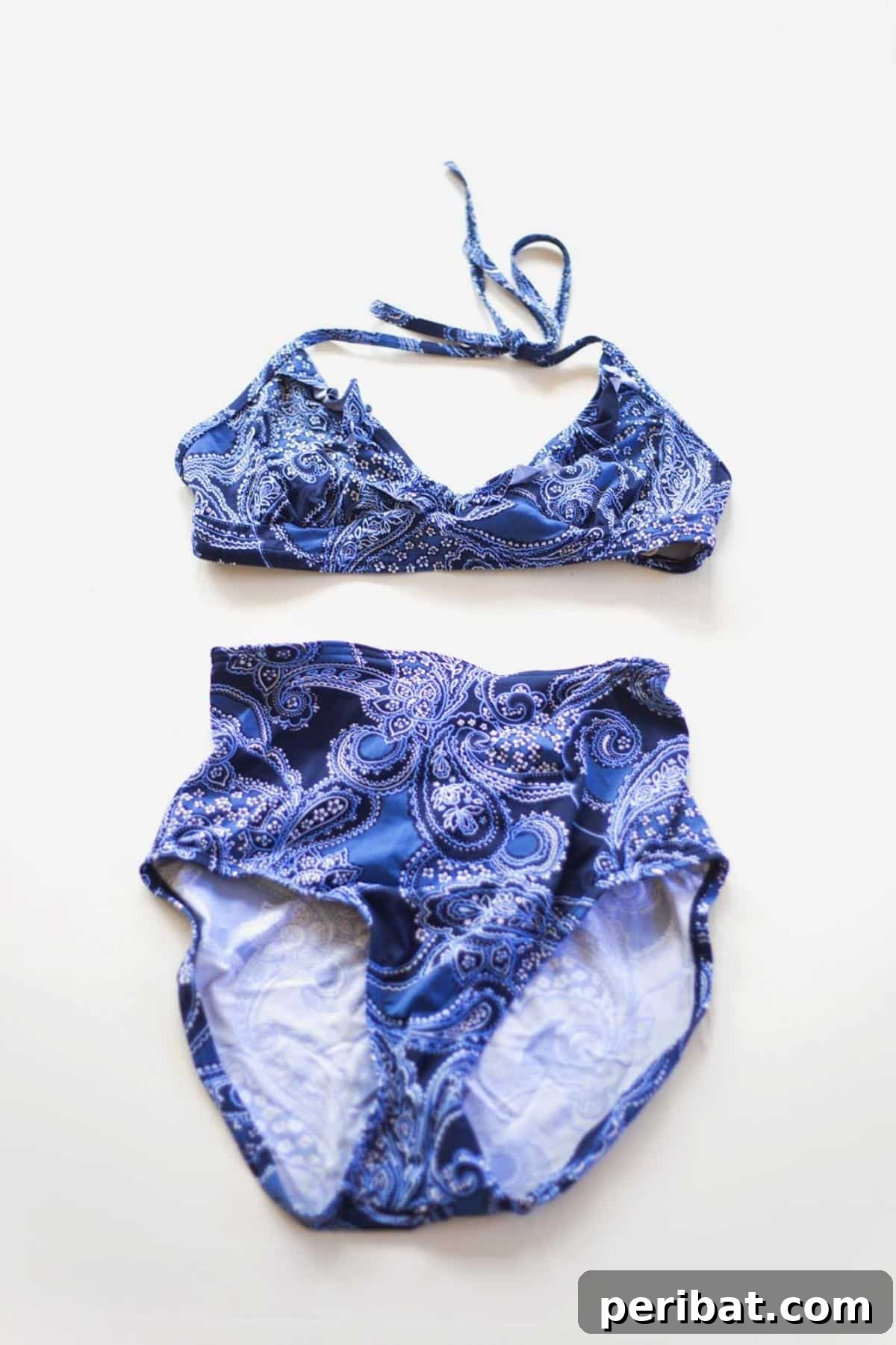 A creative DIY project to transform an old one-piece swimsuit into a trendy high-waist retro two-piece bikini.