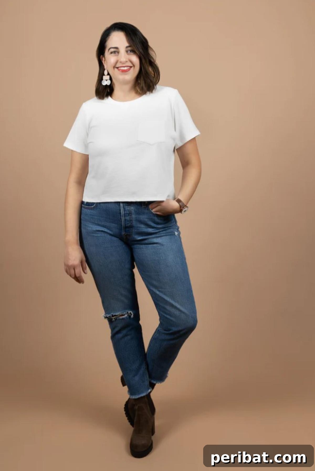 38 Creative T-Shirt Sewing Projects 11 A model wearing a classic white crew-neck t-shirt, showcasing the timeless design and versatile fit of this essential sewing pattern.