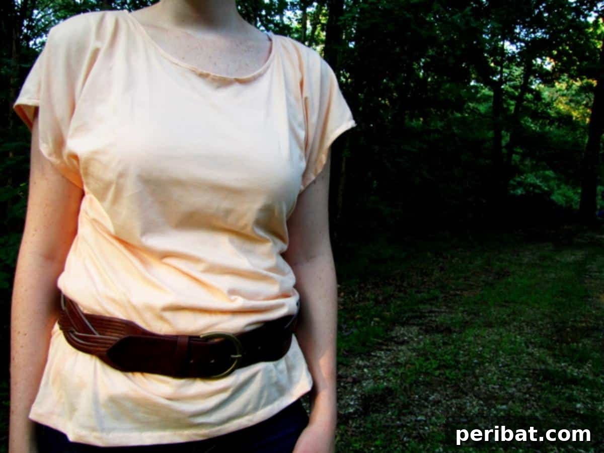 38 Creative T-Shirt Sewing Projects 16 A woman wearing an easy drapey tee in a soft, flowing fabric, ideal for comfortable and casual occasions.