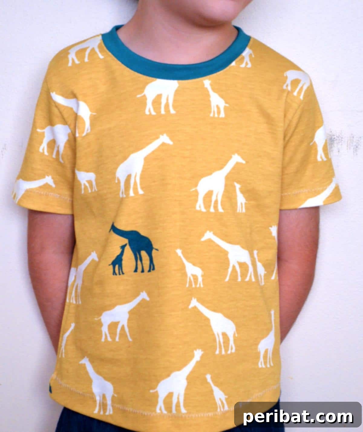 38 Creative T-Shirt Sewing Projects 21 A young girl wearing a charming short-sleeve shirt with a playful pattern, perfect for comfortable play or casual outings.