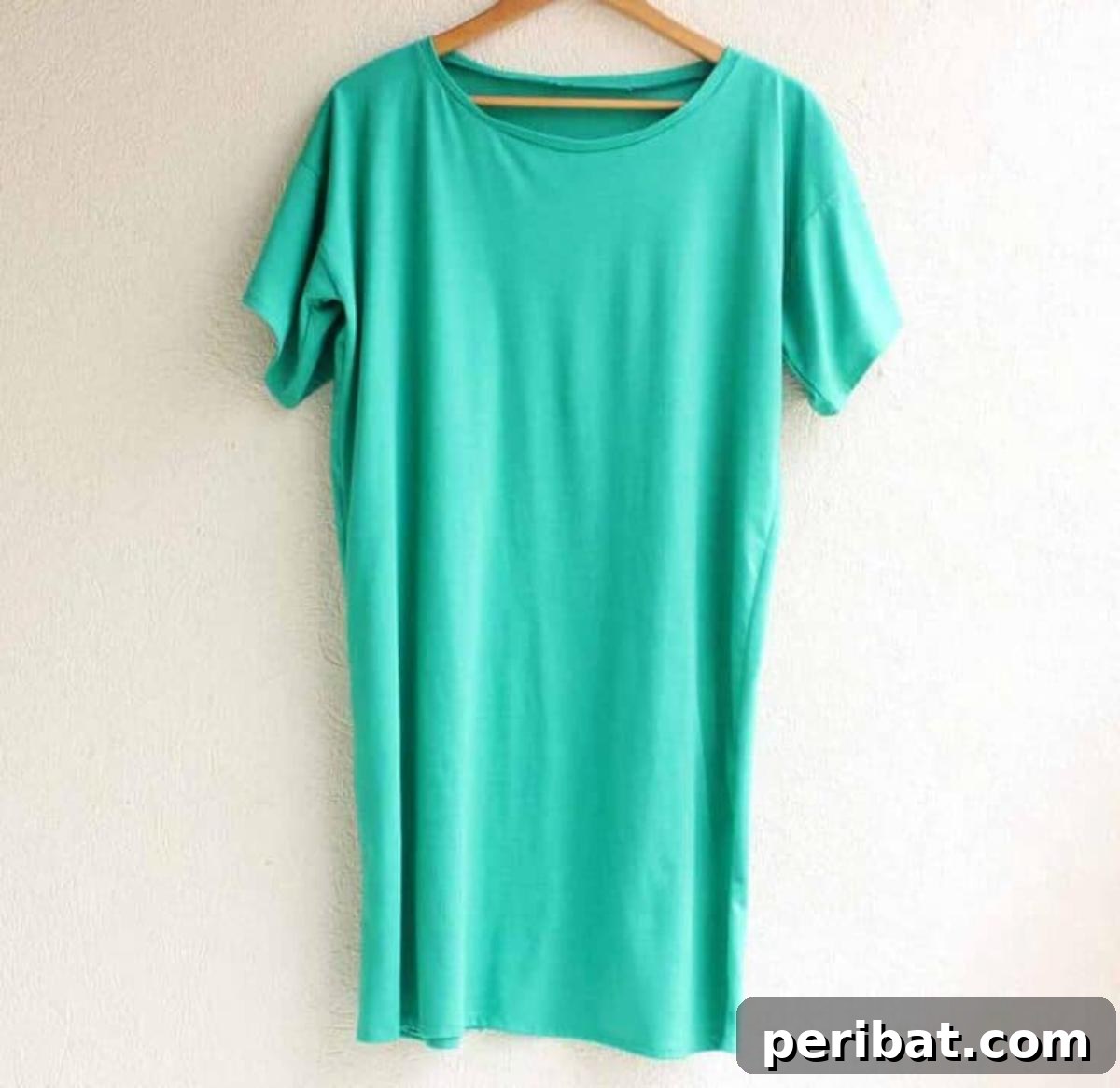 38 Creative T-Shirt Sewing Projects 22 A woman in a comfortable and stylish t-shirt dress, demonstrating how a simple sewing project can create a trendy outfit.