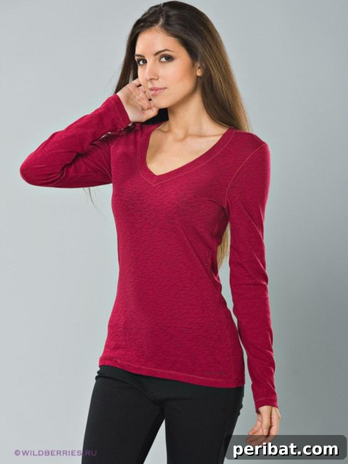 38 Creative T-Shirt Sewing Projects 24 A woman wearing a stylish long-sleeve V-neck t-shirt, showcasing a combination of warmth and fashion for cooler days.