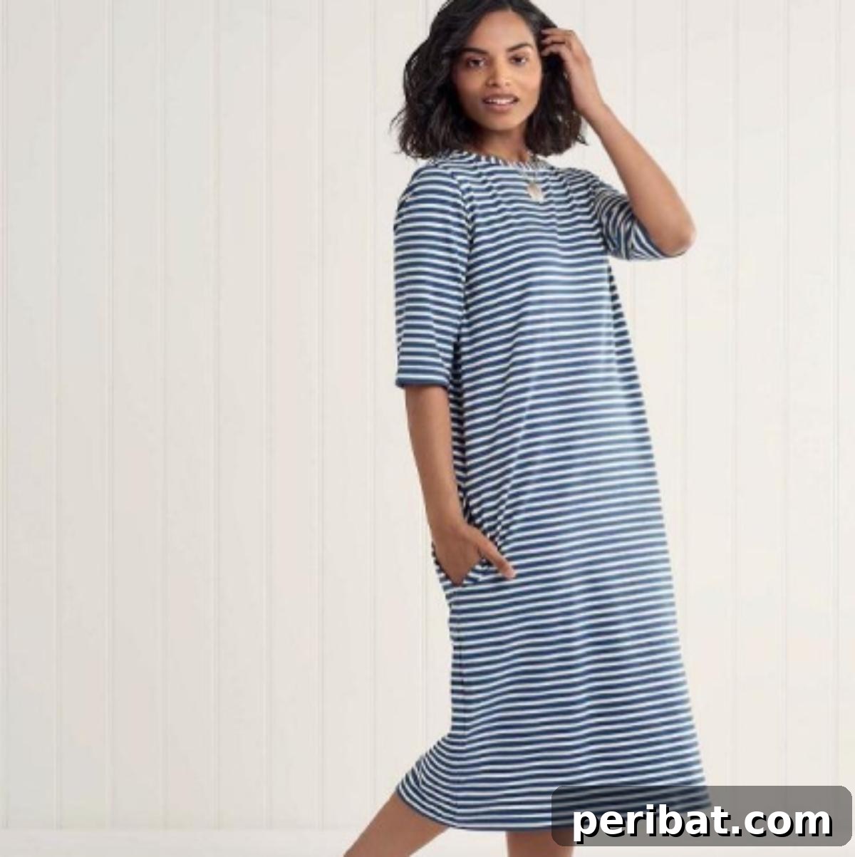 38 Creative T-Shirt Sewing Projects 29 A woman wearing a comfortable Jade T-shirt dress in a soft jersey fabric, perfect as a beach cover-up or casual daywear.