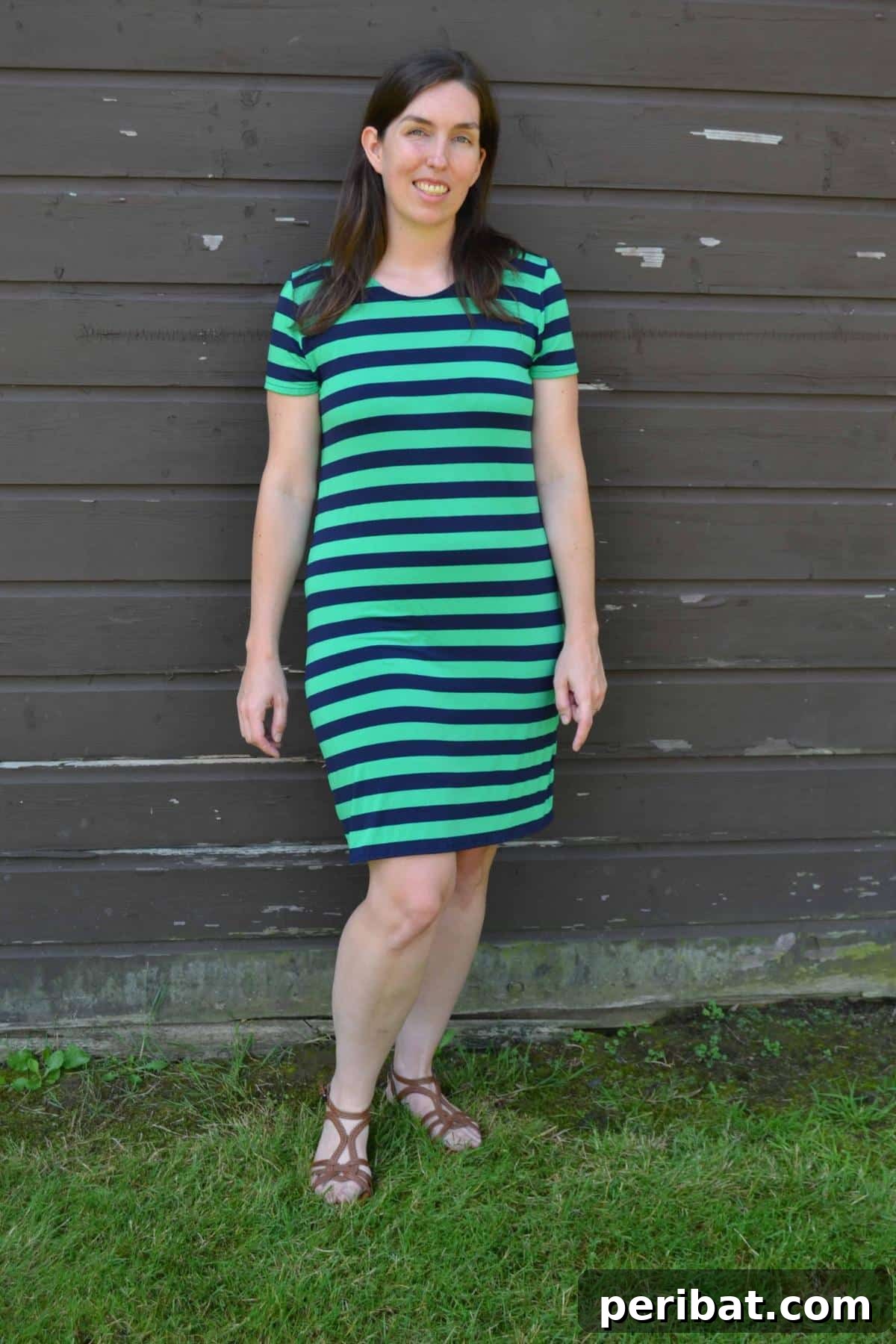 38 Creative T-Shirt Sewing Projects 30 A woman posing gracefully in a stylish T-shirt dress, showcasing the ease and comfort of this versatile garment for casual wear.