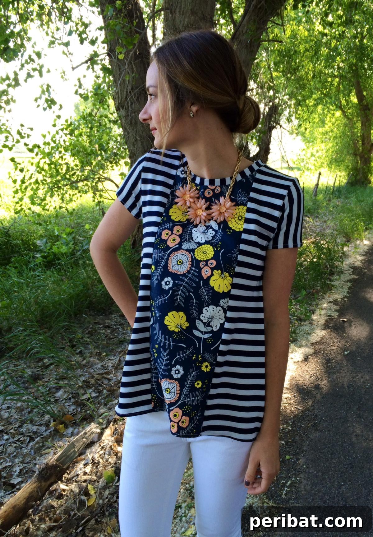38 Creative T-Shirt Sewing Projects 31 A woman modeling 'The Sunny Swing Tee', a breezy and flattering top featuring a delightful stripe and floral pattern combination.
