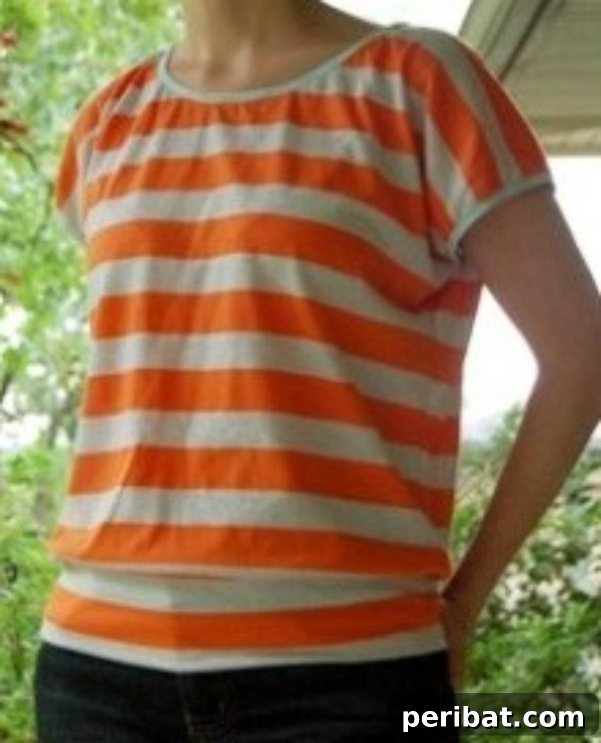 38 Creative T-Shirt Sewing Projects 33 A person wearing 'The Slouchy Shirt', a relaxed yet flattering top with a comfortable fit through the chest and waist.