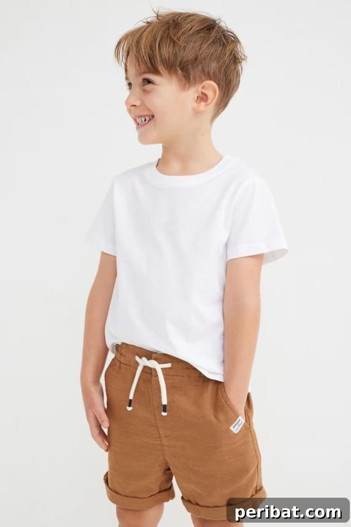 38 Creative T-Shirt Sewing Projects 40 A child proudly wearing a custom-made kids' T-shirt, featuring a playful illustration and a comfortable fit, made from a vibrant fabric.
