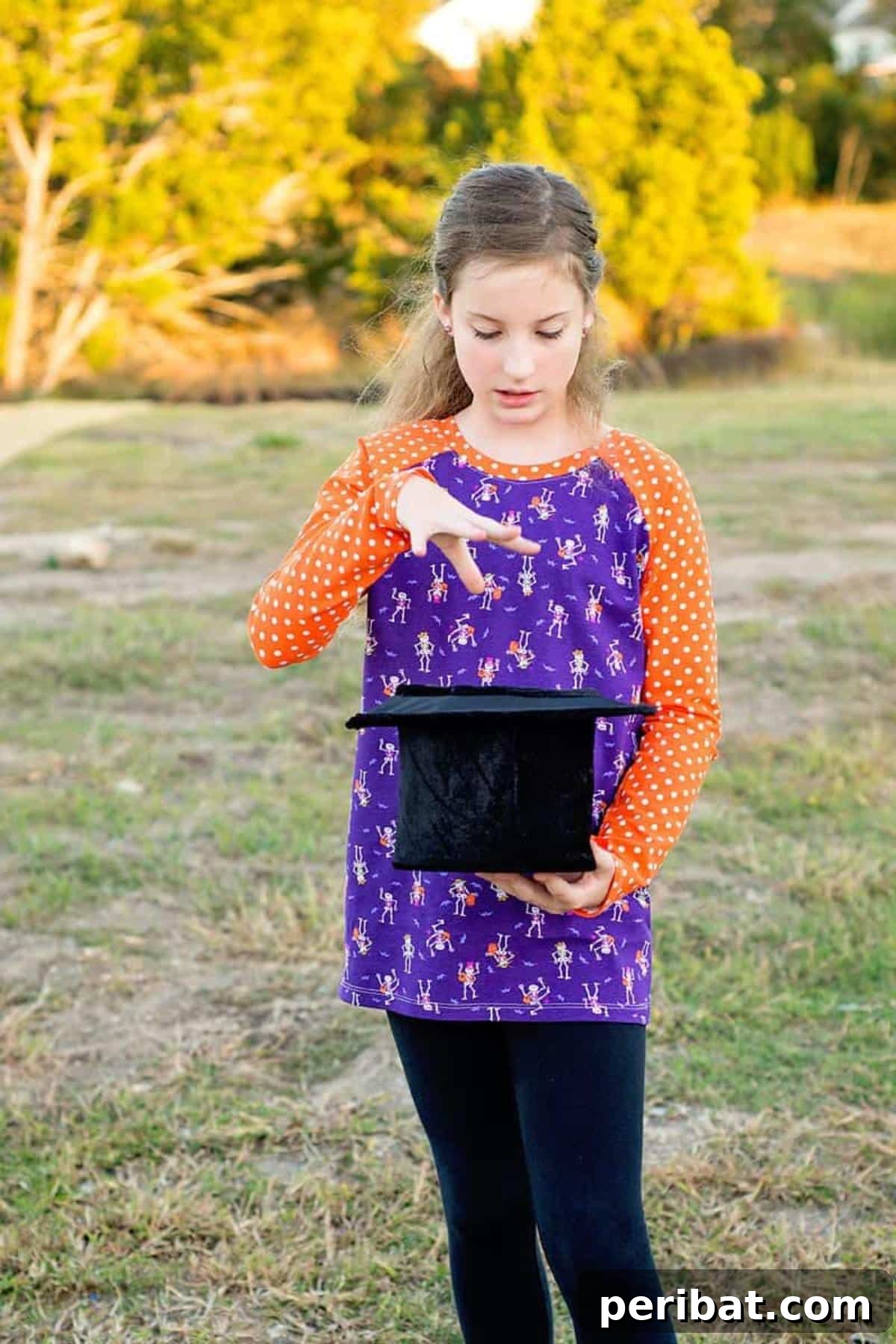 38 Creative T-Shirt Sewing Projects 8 A child wearing a two-toned raglan t-shirt, highlighting the distinctive sleeve construction of this simple and sporty sewing pattern.
