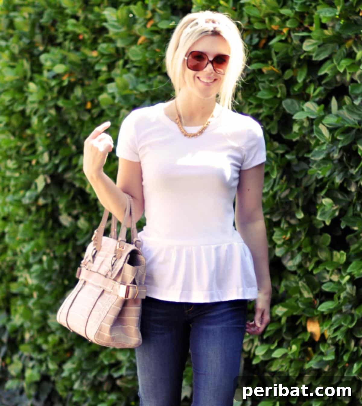 38 Creative T-Shirt Sewing Projects 10 A creative DIY peplum t-shirt made from upcycled materials, featuring a feminine silhouette and striped pattern.