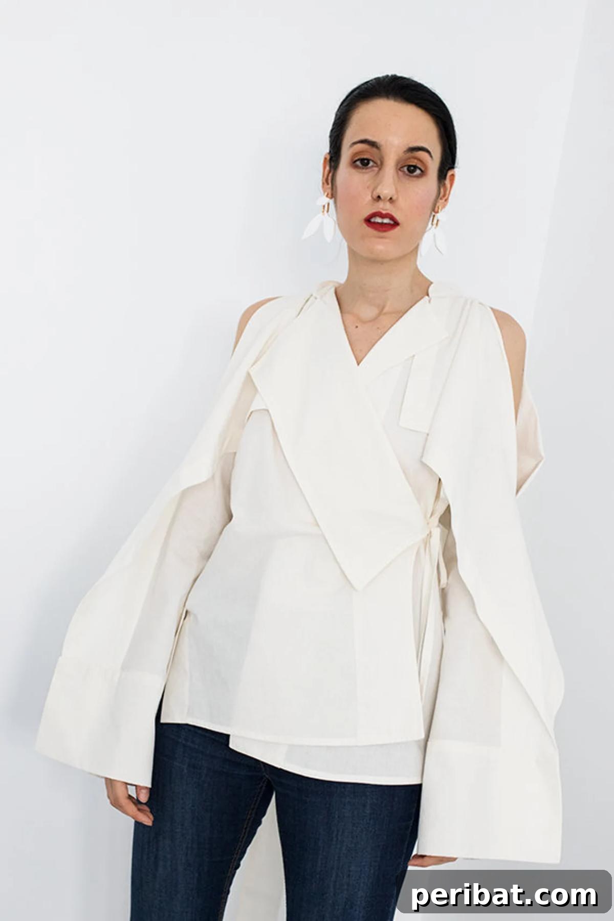 The Monica Japanese Kimono Blouse, a modern design with asymmetric lapels and exposed shoulders.
