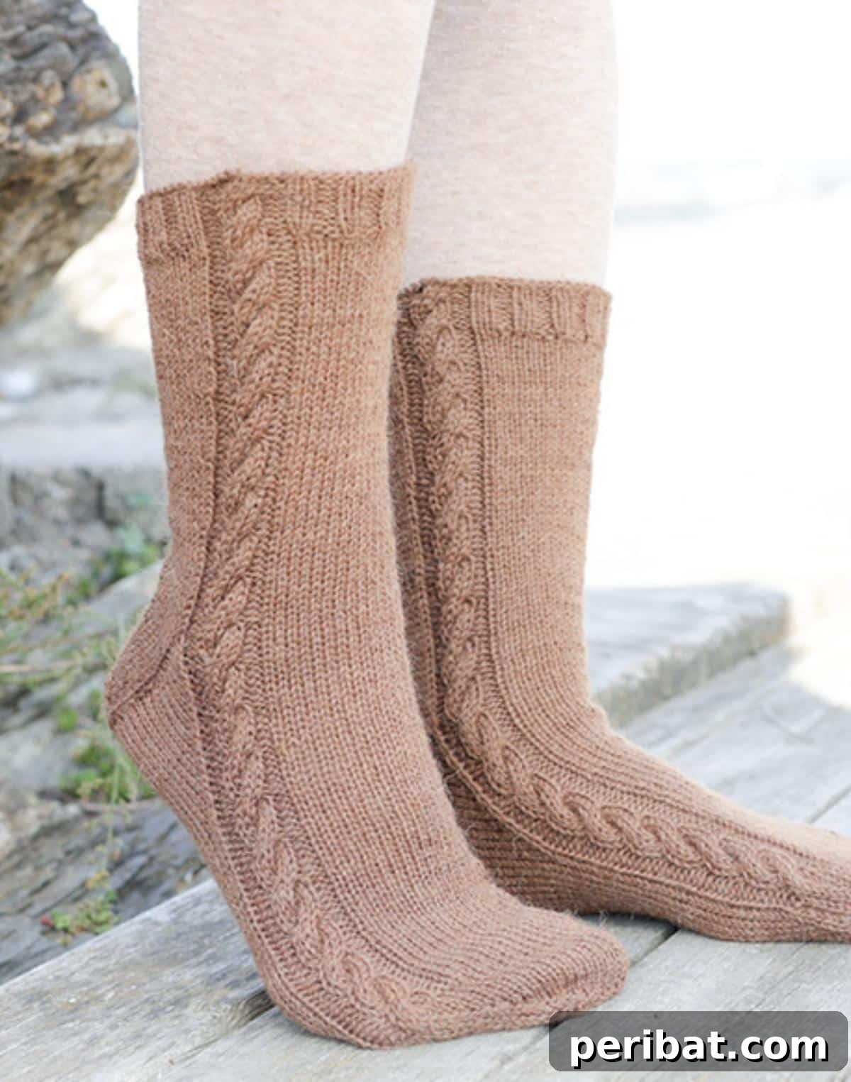 38 Cozy Sock Knitting Patterns 12 Elegant Knitted Socks in Stocking Stitch, adorned with simple yet striking cables.