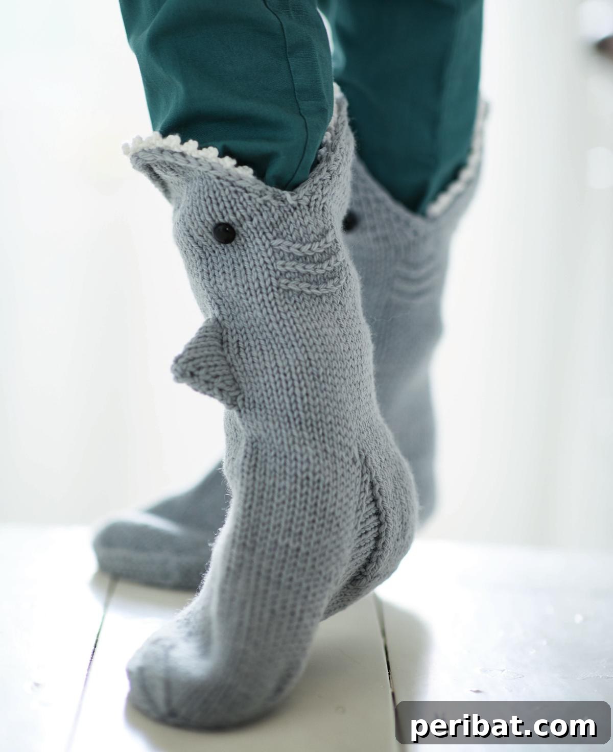 38 Cozy Sock Knitting Patterns 23 Fun and whimsical Shark Socks with distinct shark-face details.