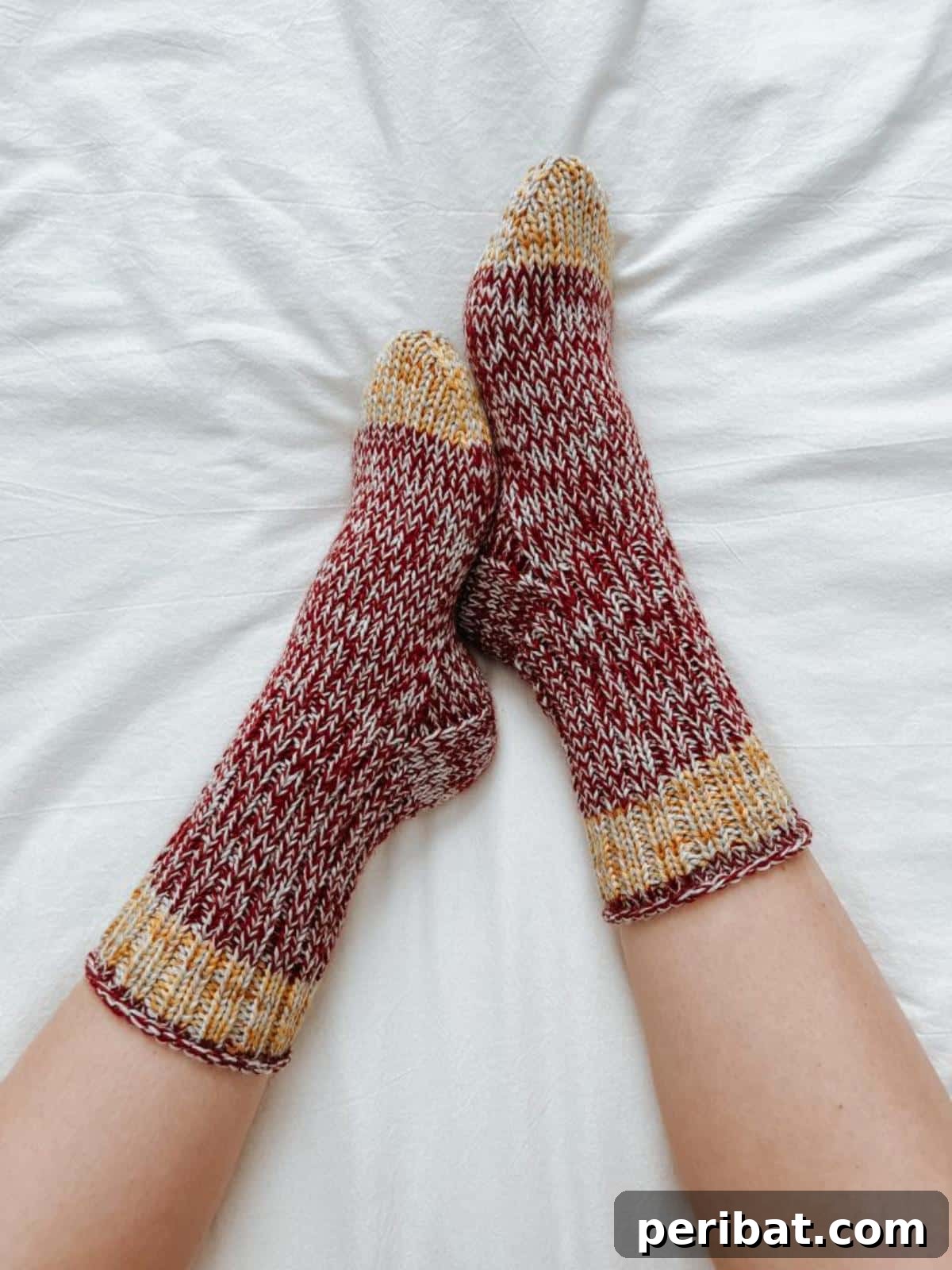 38 Cozy Sock Knitting Patterns 34 Spirited Team Socks, featuring a bold, ribbed design.